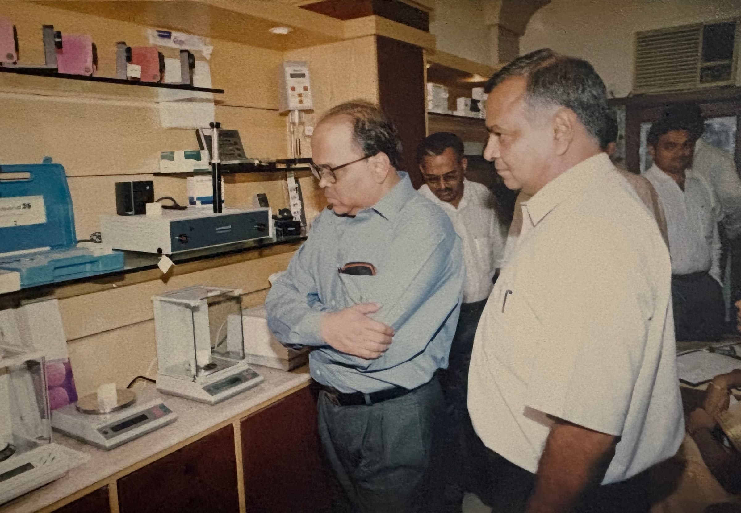 Manufacturing workshop with laboratory instruments and technical staff